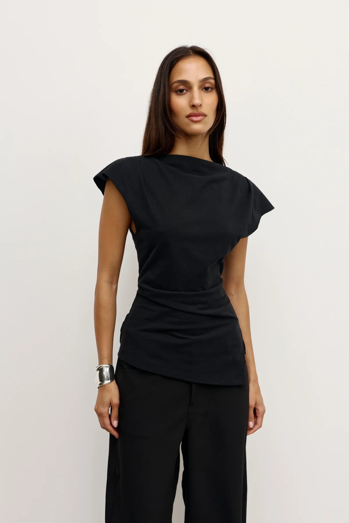 Bayse Liana Top in Black - side view showing asymmetric hem and relaxed fit