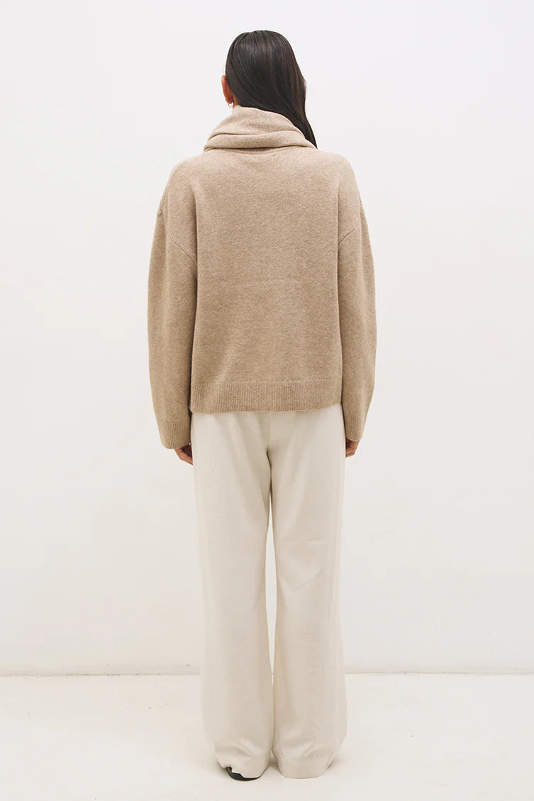 Mon Renn Scarf Knit Jumper in Natural — back view showing clean oversized silhouette in natural oat knit, styled with ivory wide-leg trousers