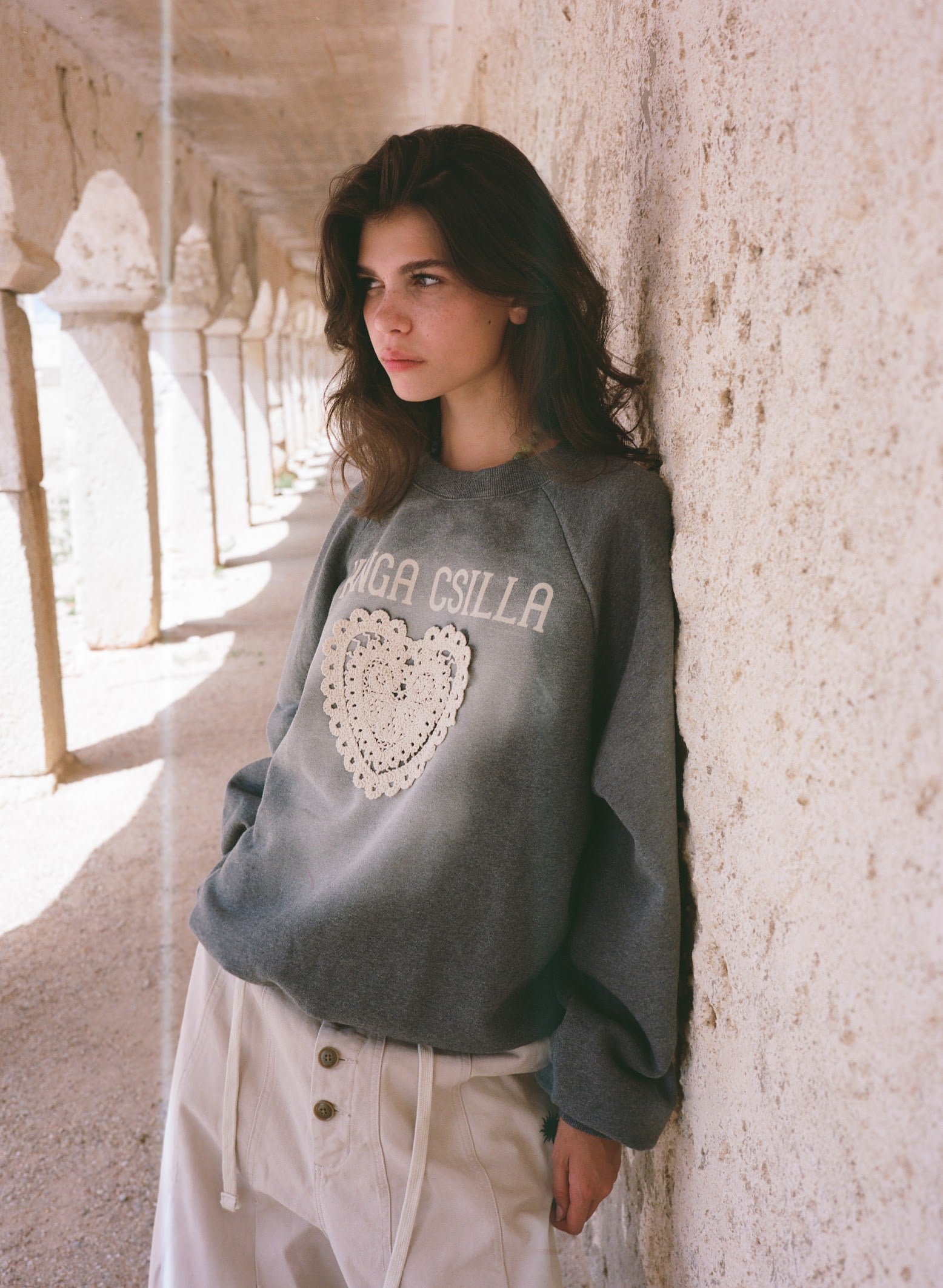 Kinga Csilla Day Hearts Med Jumper in grey marle — ribbed crew neck and cuffs, embroidered crest patch on sleeve