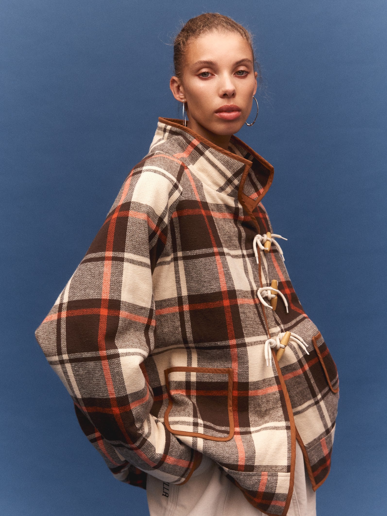 Kinga Csilla Rally Quilted Cocoon Jacket in tartan check — campaign image, Domenica Collection, shot on film in Portugal