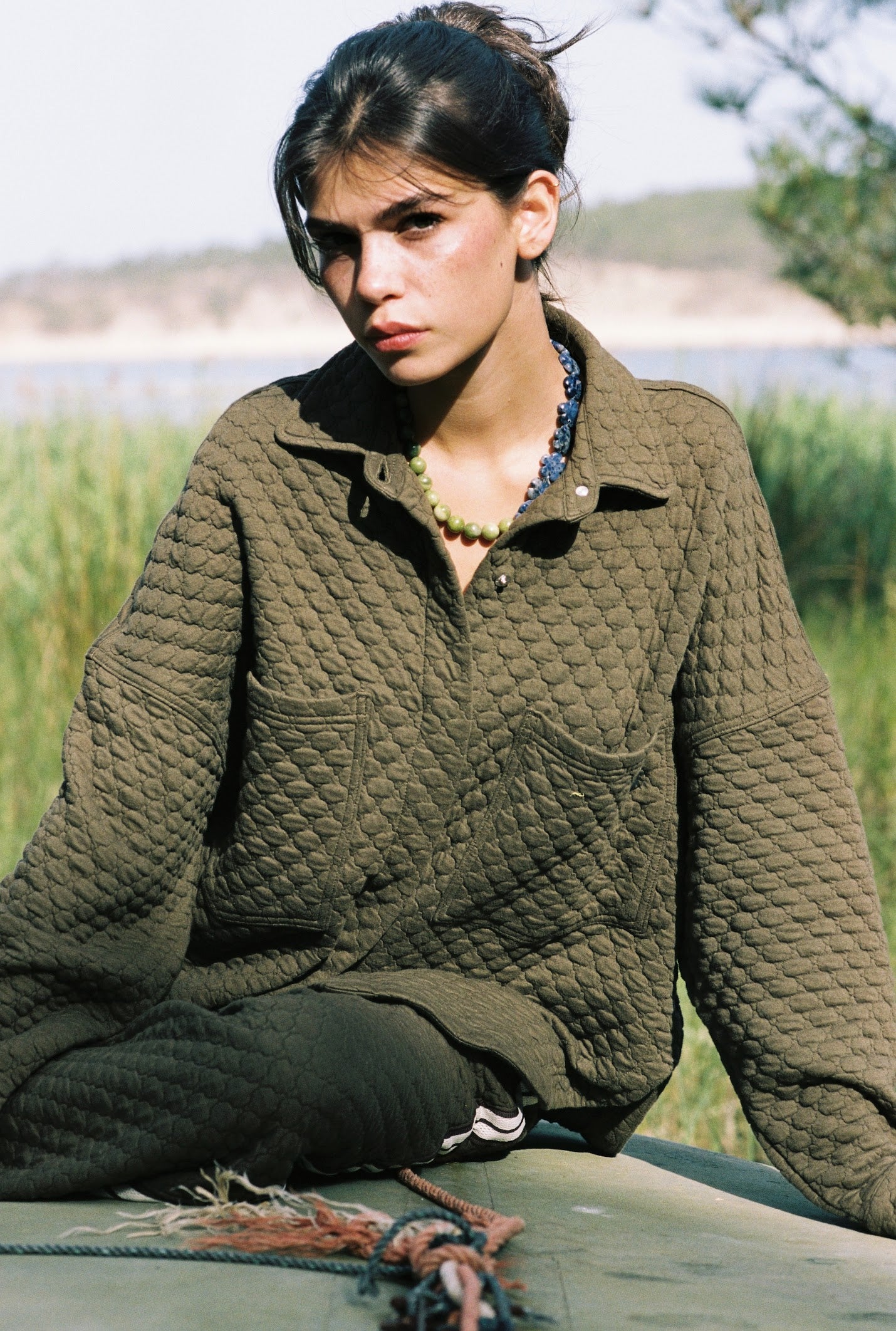 Kinga Csilla Sabbia Quilted Double Pocket Shirt in olive — worn open as a layering piece