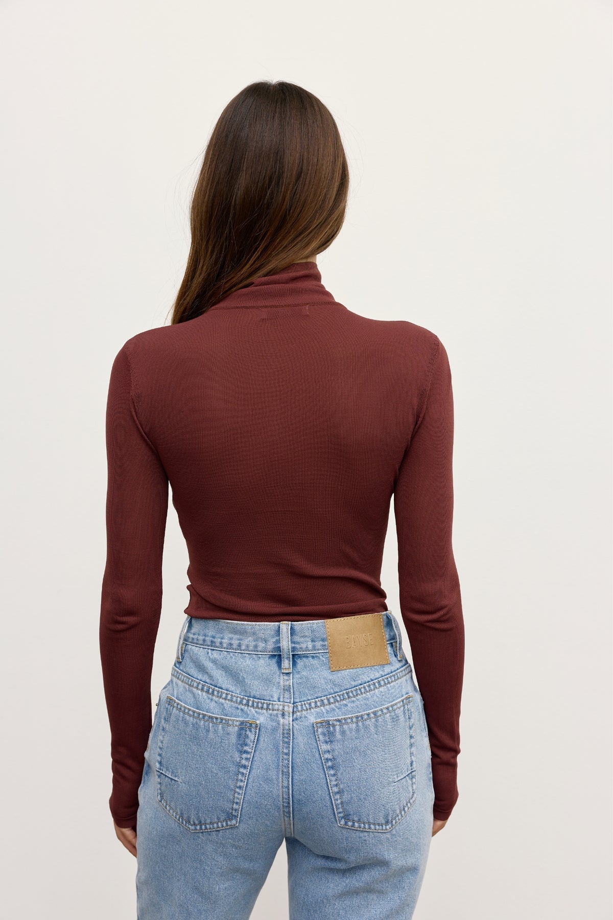Bayse Airlie Top Burgundy - full length view styled with denim jeans
