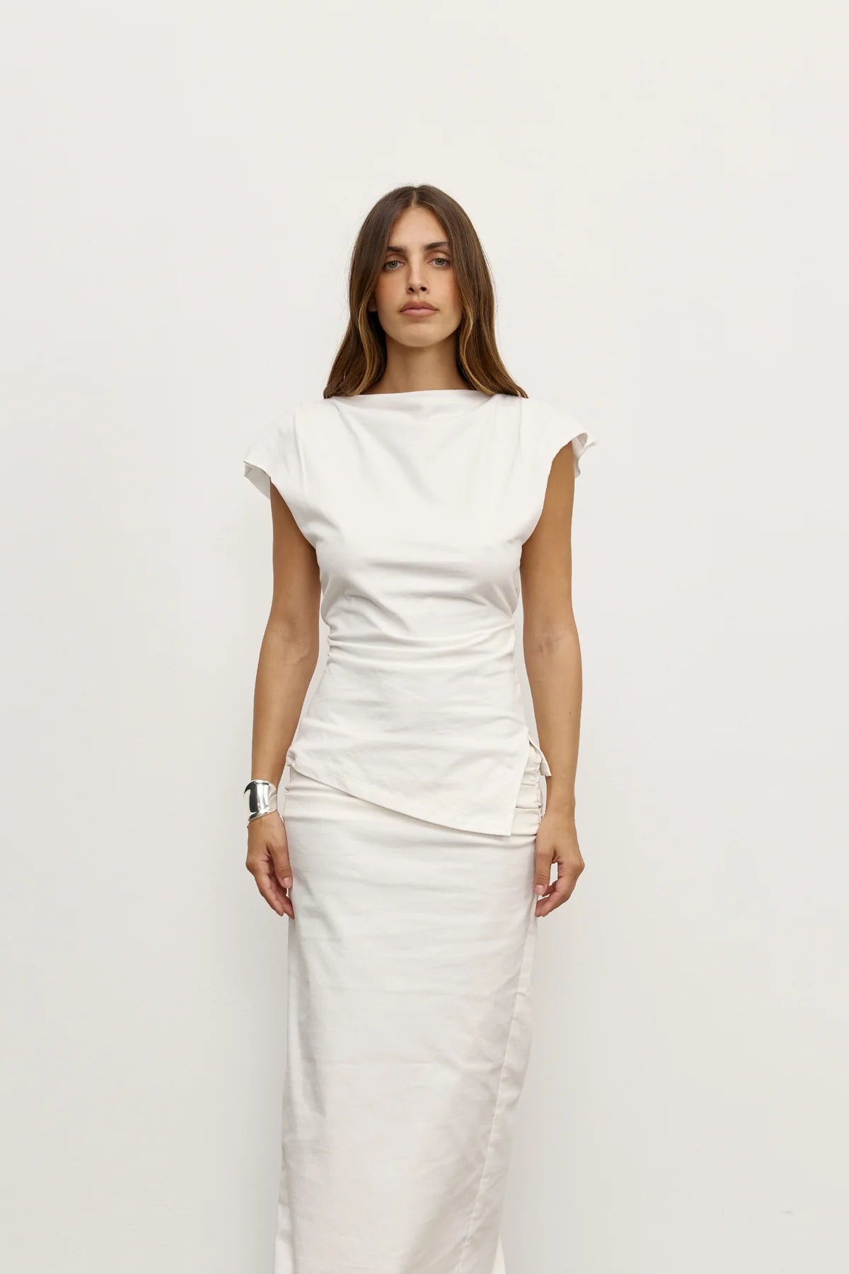 Bayse Liana Top in White - side view showing asymmetric hem and relaxed silhouette