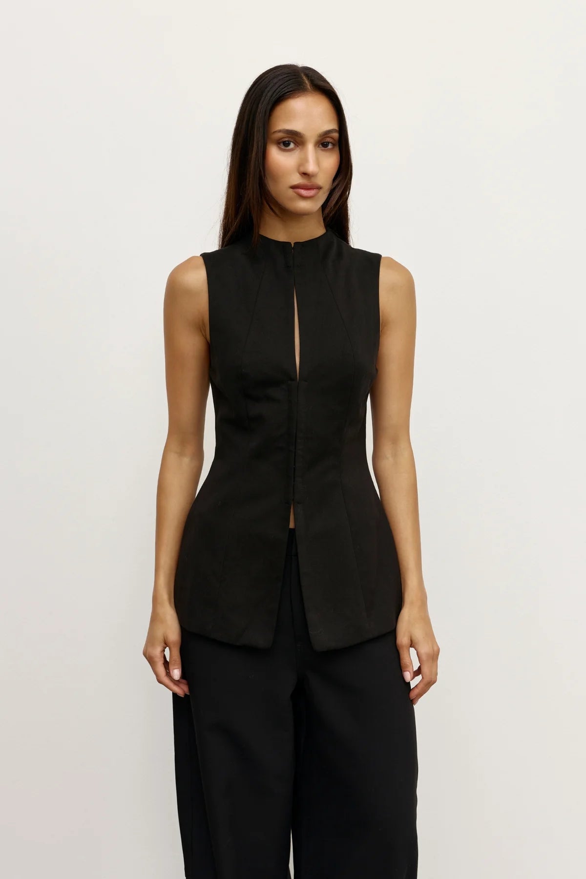 Bayse Rowe Top in Black - side view showing structured silhouette and elongated line