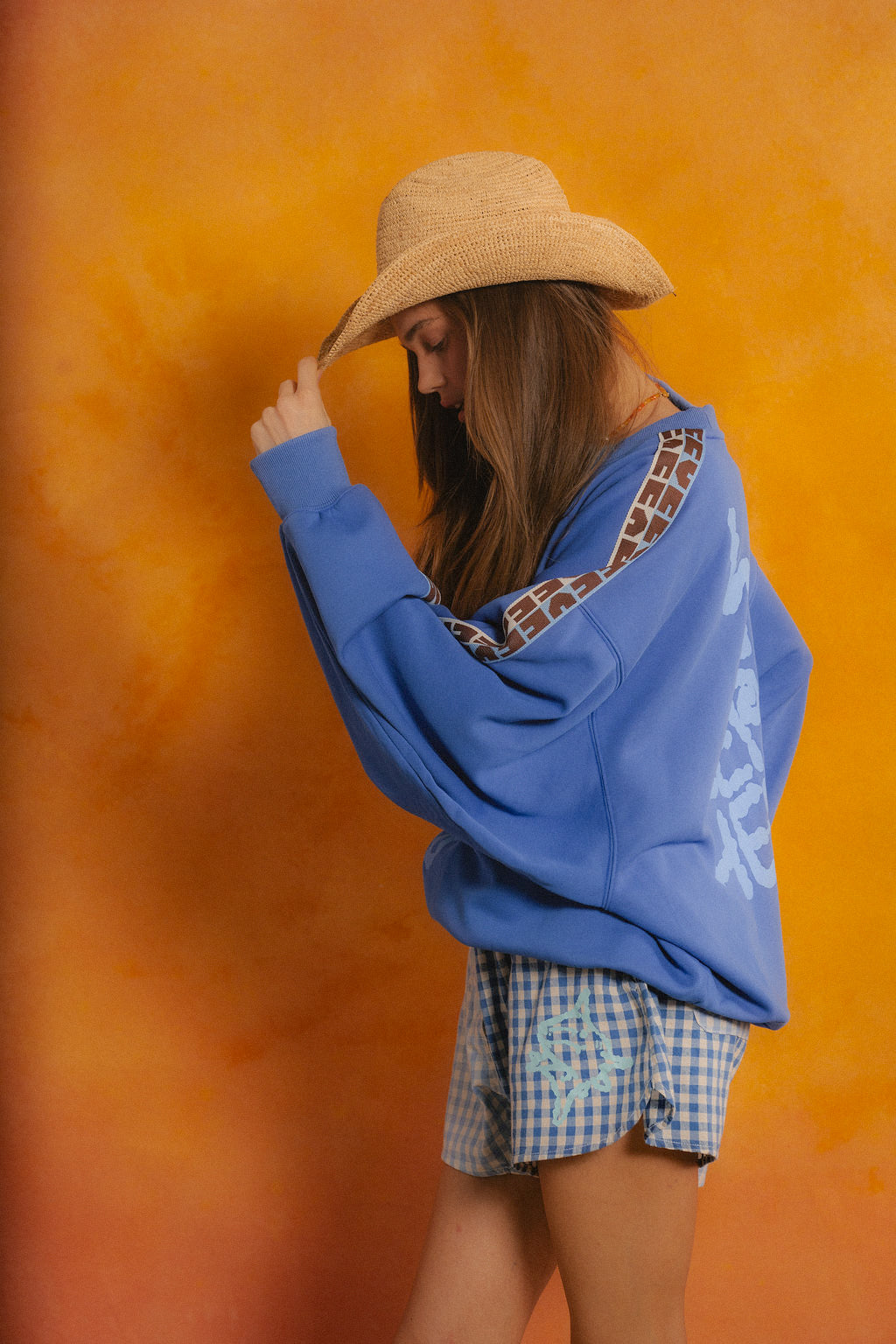 Ciao Ciao Vacation Bluefin OS Sweater - full length campaign shot in cornflower blue cotton fleece