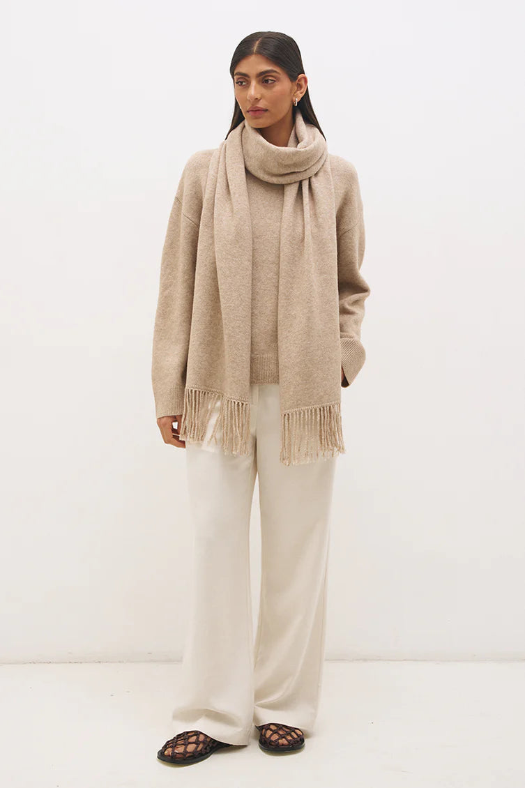 Mon Renn Scarf Knit Jumper in Natural — full length front view with scarf draped and fringe tassels, styled with ivory wide-leg trousers