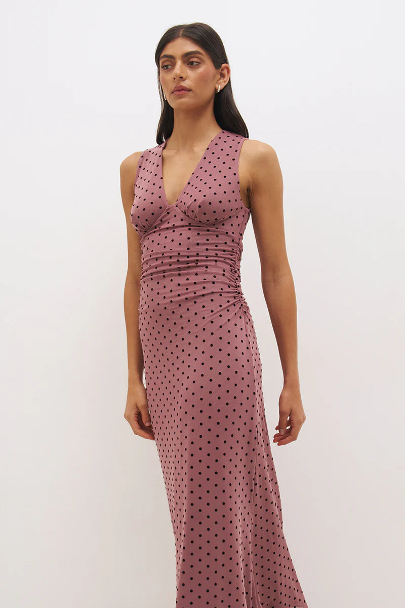 Mon Renn Sonata Spot Dress in Rosewood And Black — cropped upper body shot showing plunging V-neckline, empire line ruching and body-skimming fit through torso in rosewood polka dot