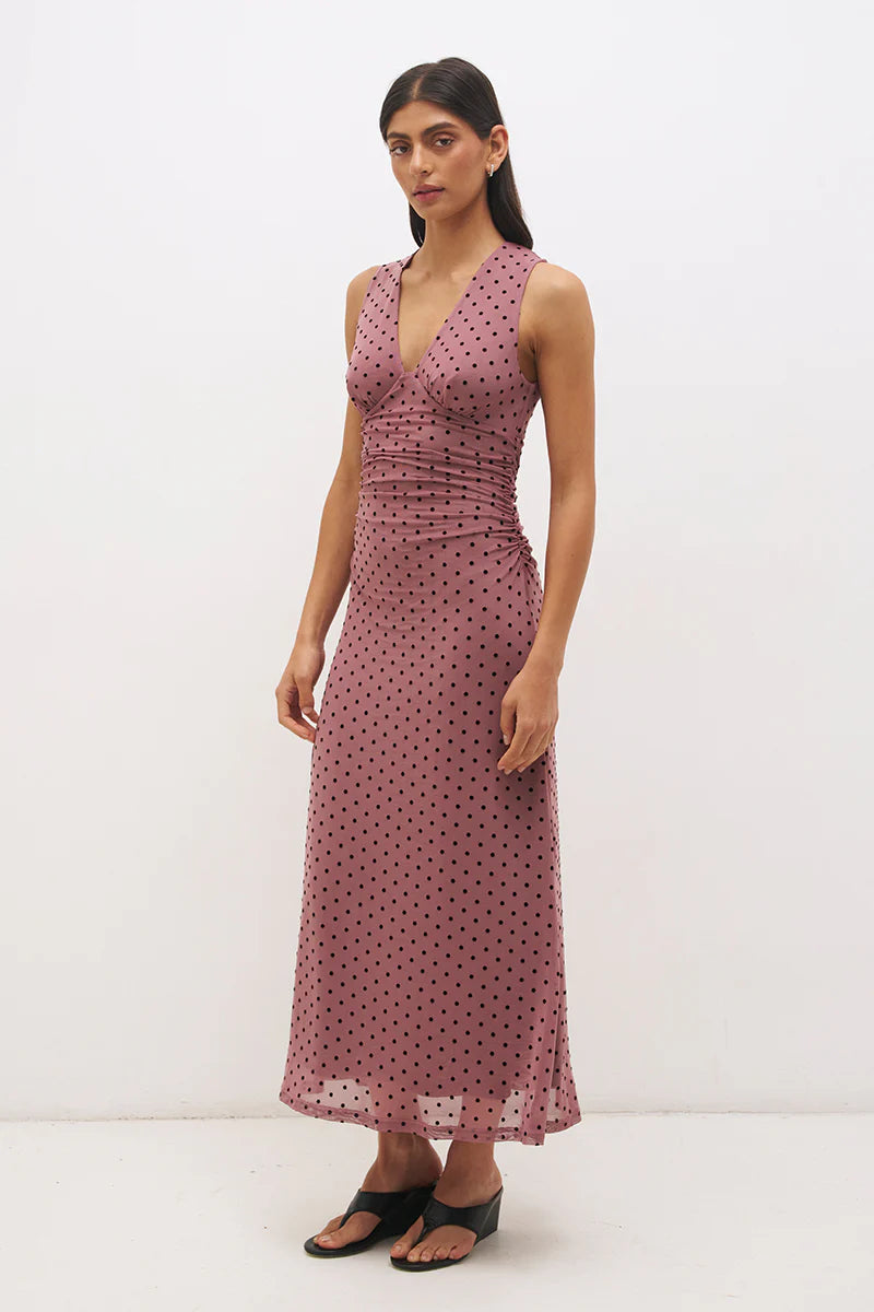 Mon Renn Sonata Spot Dress in Rosewood And Black — three-quarter side view showing full maxi length, empire silhouette and flared skirt in flocked rosewood polka dot mesh