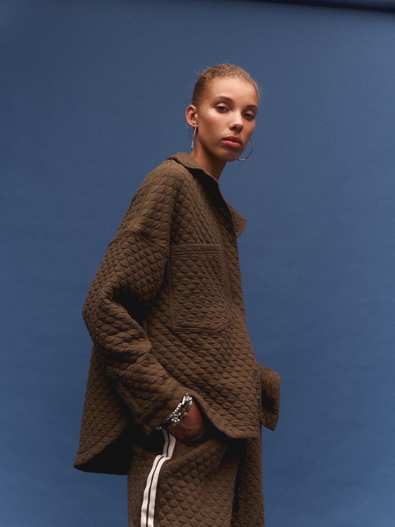 Kinga Csilla Sabbia Quilted Double Pocket Shirt in dark brown — back detail showing tonal embroidered motif